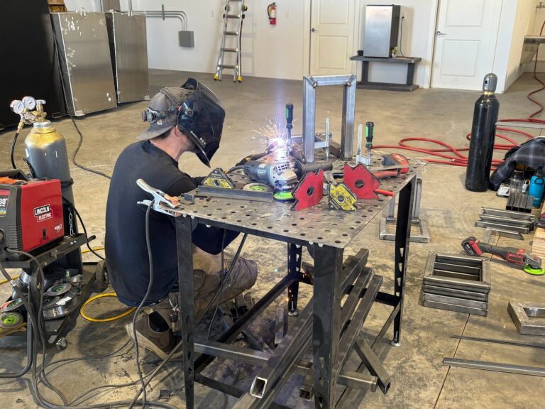 Welding a bin cleaning trailer frame
